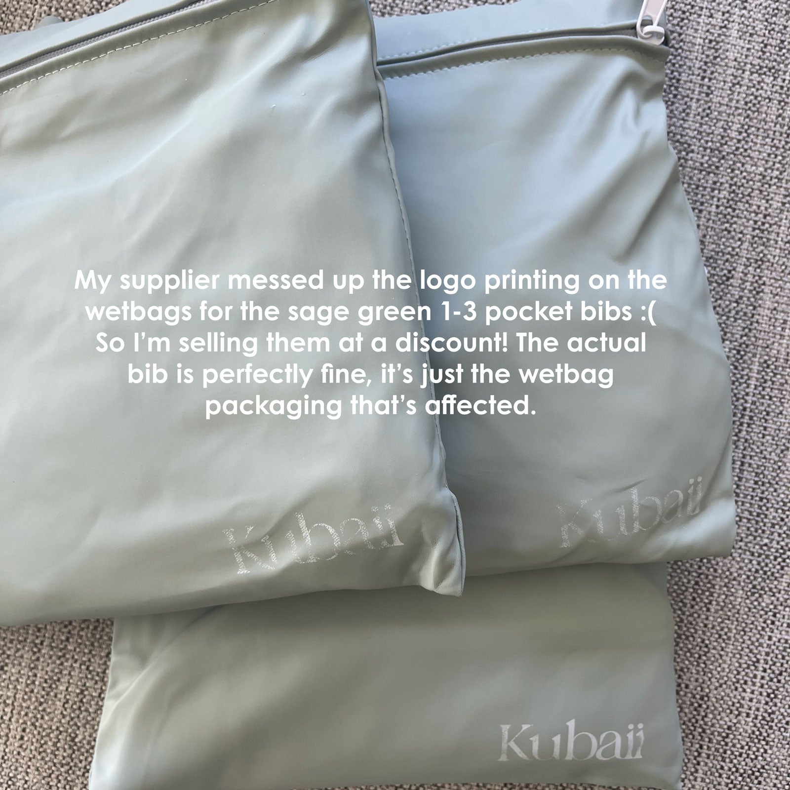 Kubaii Sage Green waterproof bib outlet sale - packaging seconds with minor print error.